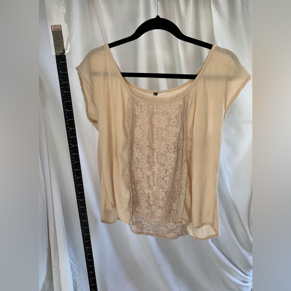 O’Neill blush coloured short sleeve top.